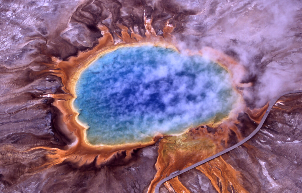 Aerial view of Grand Prismatic Spring's blue center and orange rings in Yellowstone's Midway Geyser Basin