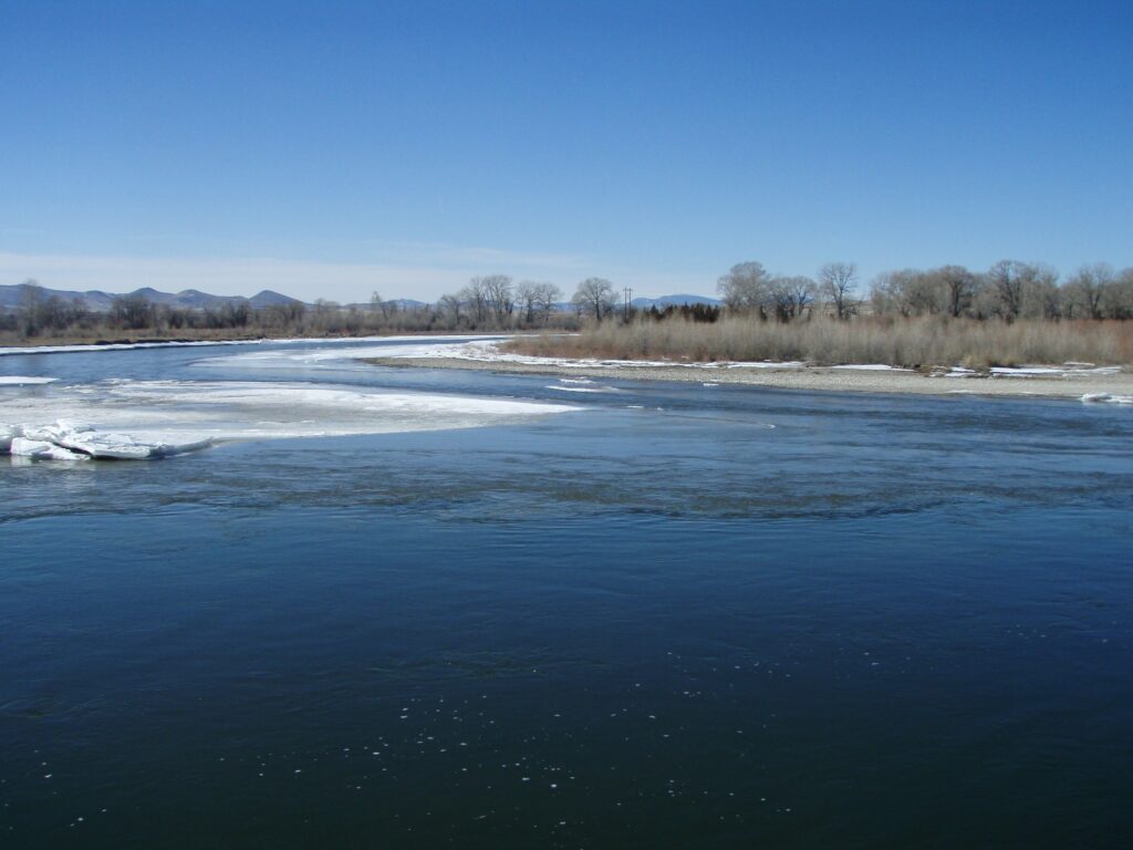 Madison and Jefferson Rivers meeting at Missouri Headwaters State Park near Three Forks, Montana, with ice on the banks
