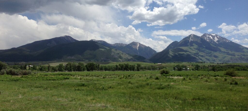 Absaroka Range rising above green pastures in Paradise Valley south of Livingston, Montana