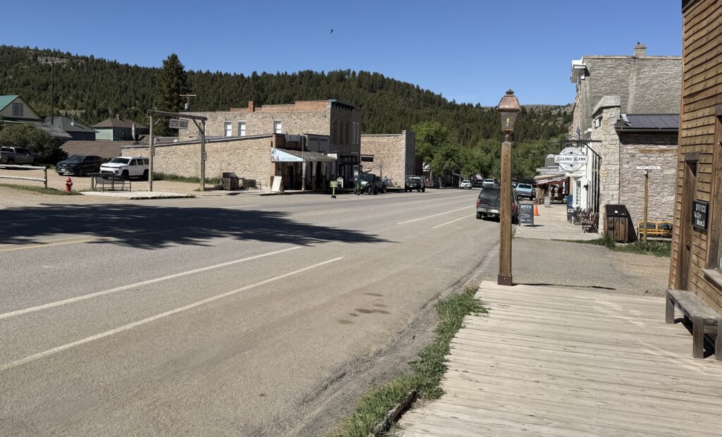 Wooden boardwalk and historic storefronts along the main street of Virginia City, Montana