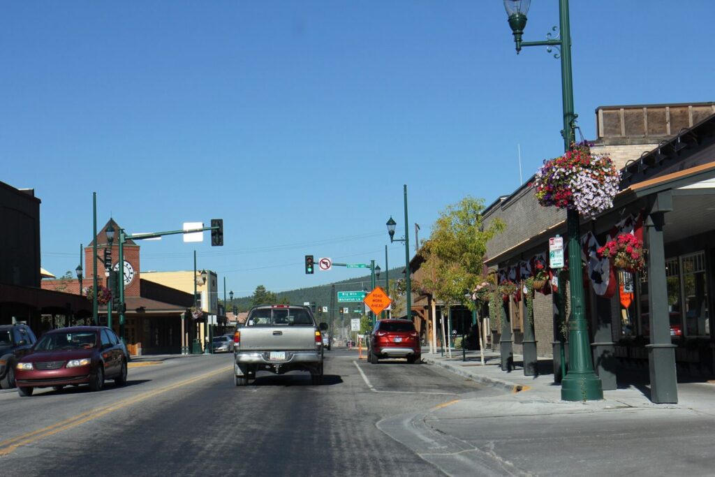 Downtown Whitefish, Montana, with shops and hanging flower baskets along U.S. Route 93